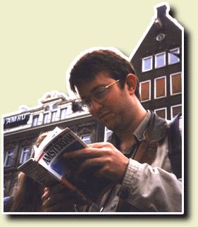 Photo of Loyd looking in a guide book